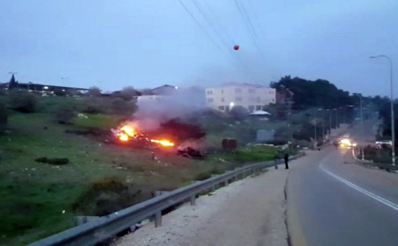 In this image made from video provided by Yehunda Pinto, the wreckage of a jet is seen on fire near Harduf, northern Israel, Saturday, Feb. 10, 2018. The Israeli military shot down an Iranian drone that infiltrated the country early Saturday before launching a "large-scale attack" on at least a dozen Iranian and Syrian targets in Syria. Israel called it a "severe and irregular violation of Israeli sovereignty" and warned of further action against the unprecedented Iranian aggression. 