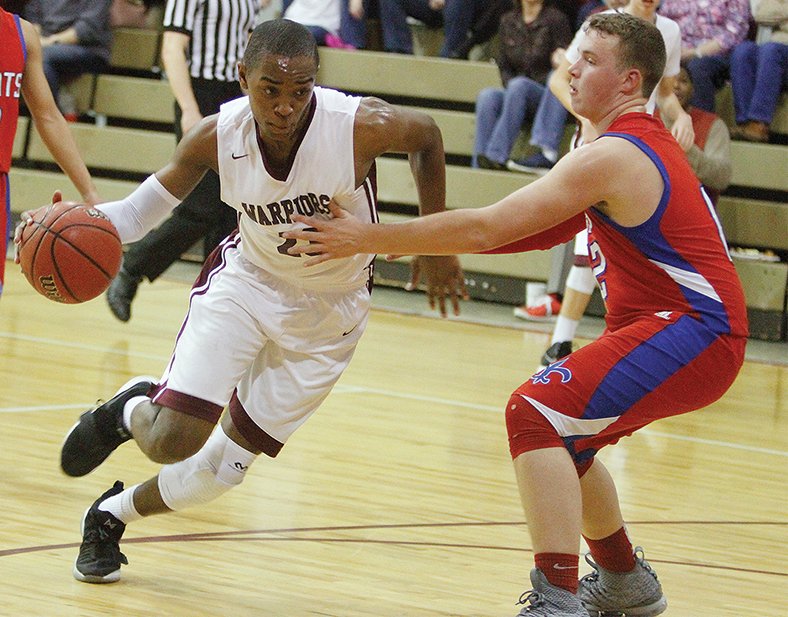Terrance Armstard/News-Times West Side Christian’s Stephfan Tabe (23) drives past Garrett Memorial Christian’s Devin Harris (12) during the first half of their contest in the AACS South District Tournament on Friday.