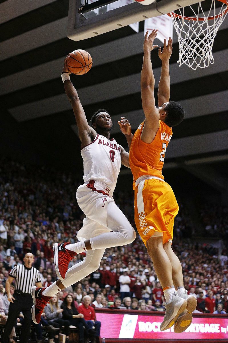 Alabama forward Donta Hall shoots over Tennessee forward Grant Williams during the Crimson Tide’s 78-50 victory over the No. 15 Volunteers on Saturday in Tuscaloosa, Ala. Hall had 17 points and 11 rebounds for the Crimson Tide.