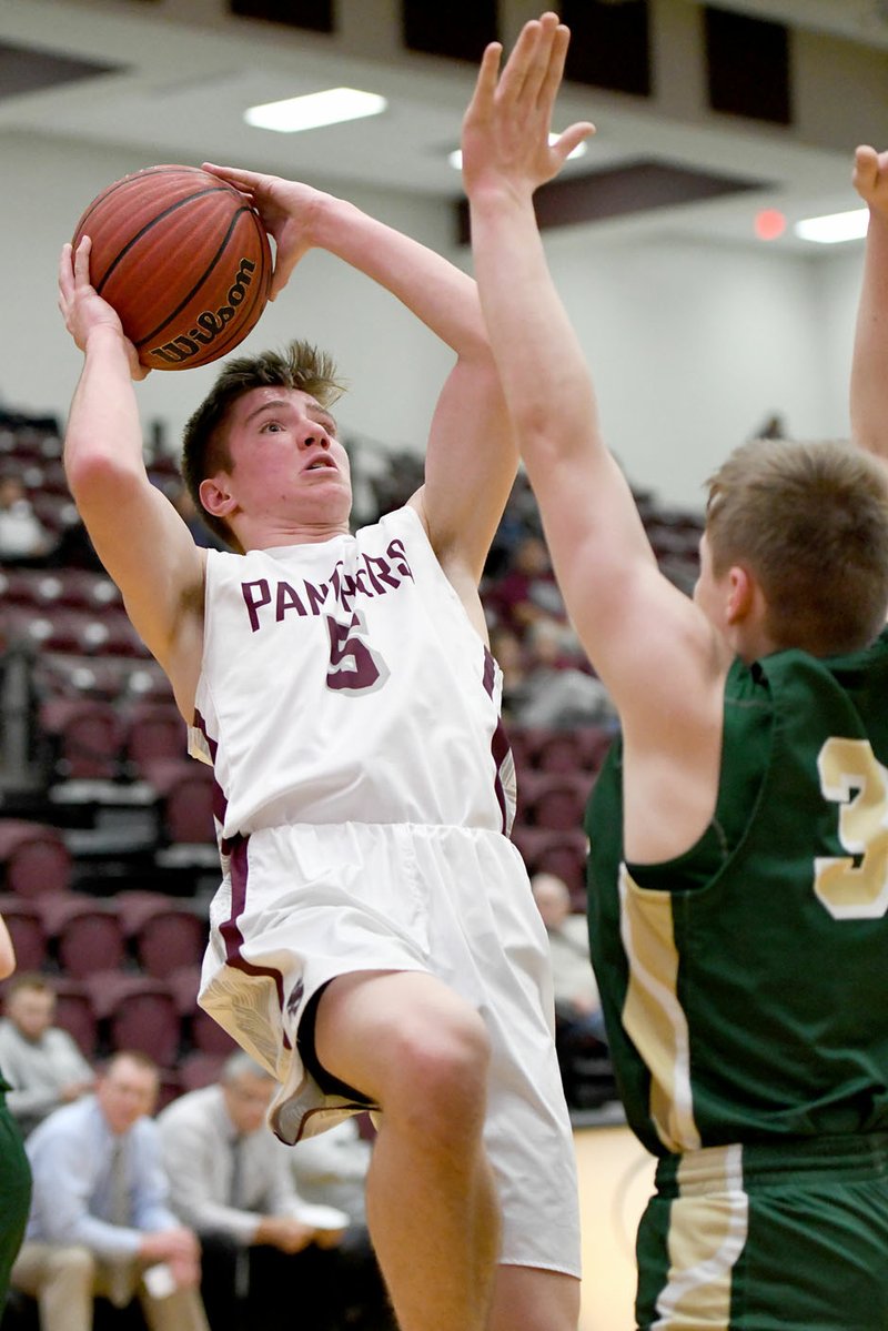 Bud Sullins/Special to Siloam Sunday Siloam Springs sophomore Drew Vachon shoots as Alma's Christian Stahler defends on the play. Alma defeated the Panthers 65-48.