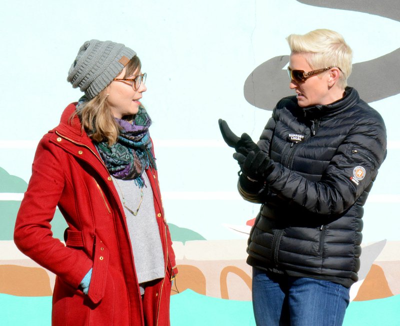 Janelle Jessen/Siloam Sunday Amanda Brinkman, right, host of Small Business Revolution, interviewed Kelsey Howard, director of Main Street Siloam Springs, during Brinkman's tour of downtown Siloam Springs on Jan. 17. Siloam Springs is one of 10 communities in the running to be featured on the HULU show Small Business Revolution -- Main Street Season 3. Brinkman is expected to announce the top five finalists in a Facebook live video on Feb. 13. The public will then have a week to vote for their favorite town and a winner will be announced at the end of the month. The winning town will receive $500,000 for revitalization and marketing advice from Small Business Revolution experts.