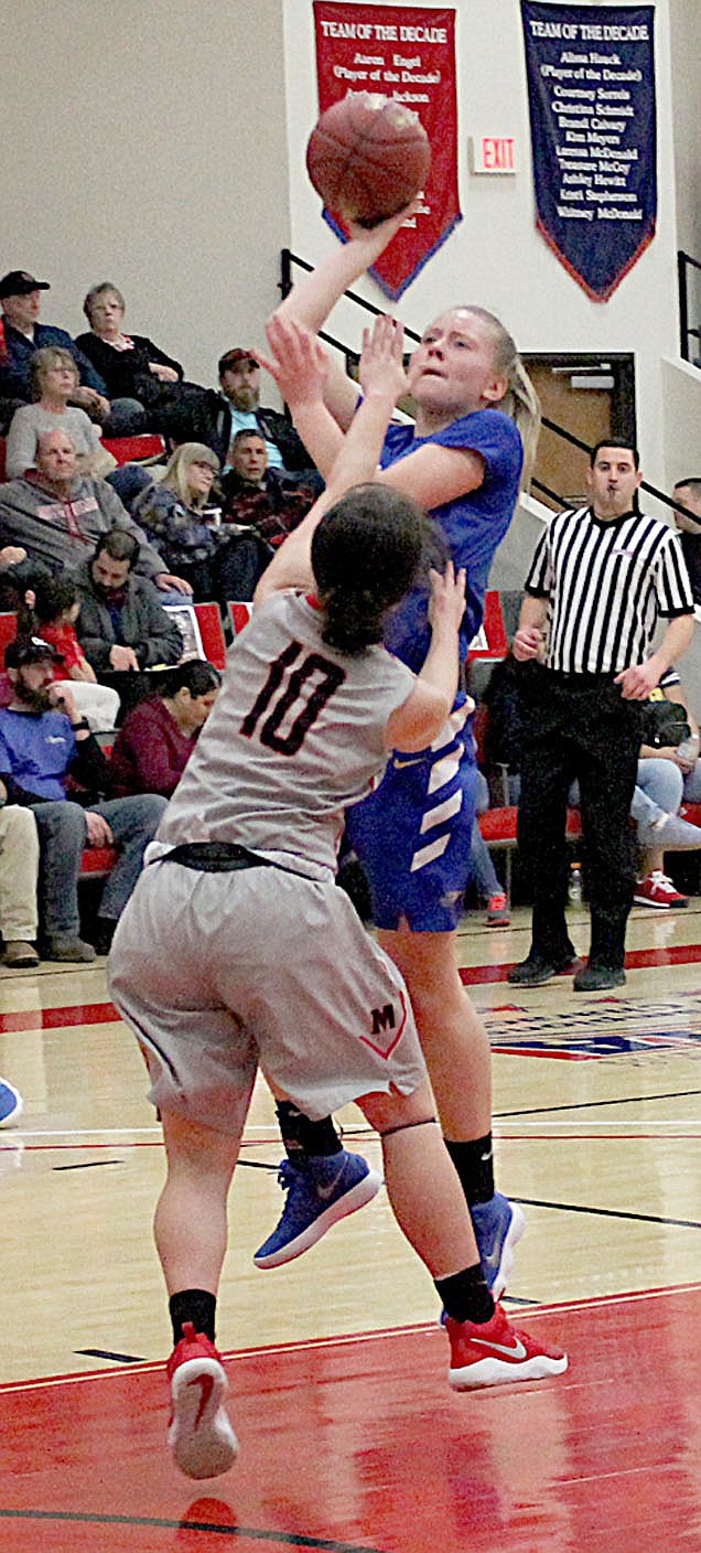 Photo courtesy of Mid-America Christian John Brown senior Rosa Orpo takes a shot over Mid-America Christian's Alexis Shannon during Thursday's game in Oklahoma City. Mid-America Christian defeated the Golden Eagles 95-81.