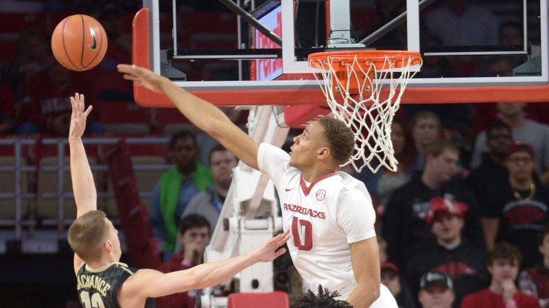 Arkansas' Daniel Gafford (10) reaches to block a shot by Vanderbilt's Riley LaChance Saturday, Feb. 10, 2018, during the first half of play in Bud Walton Arena in Fayetteville.