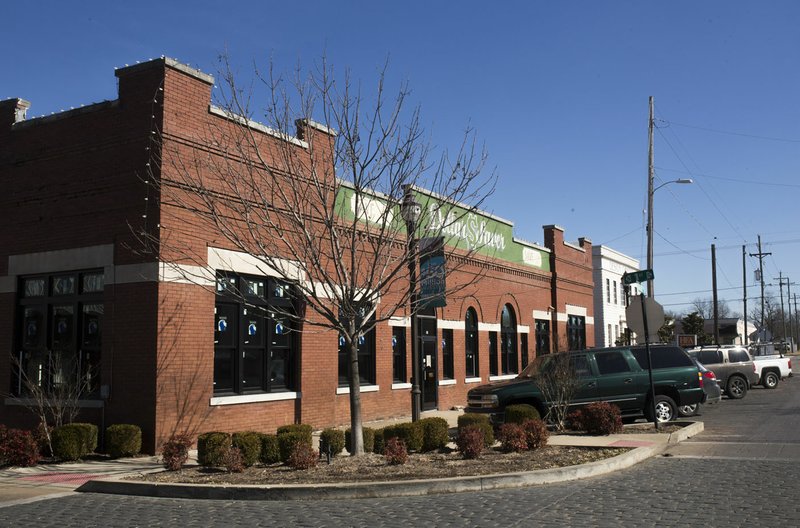 The old Dollar Saver building is shown Thursday in Rogers.