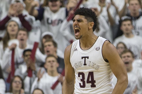 Texas A&M center Tyler Davis (34) reacts after a foul against Kentucky during the first half of an NCAA college basketball game Saturday, Feb. 10, 2018, in College Station, Texas. (AP Photo/Sam Craft)