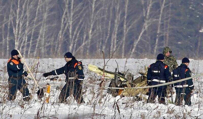 The Associated Press CRASH SCENE: Personnel work at the scene of a AN-148 plane crash in Stepanovskoye village, about 40 kilometers (25 miles) from the Domodedovo airport, Russia. A Russian passenger plane carrying 71 people crashed Sunday near Moscow, killing everyone aboard shortly after the jet took off from one of the city's airports. The Saratov Airlines regional jet disappeared from radar screens a few minutes after departing from Domodedovo Airport en route to Orsk, a city some 1,500 kilometers (1,000 miles) southeast of Moscow.