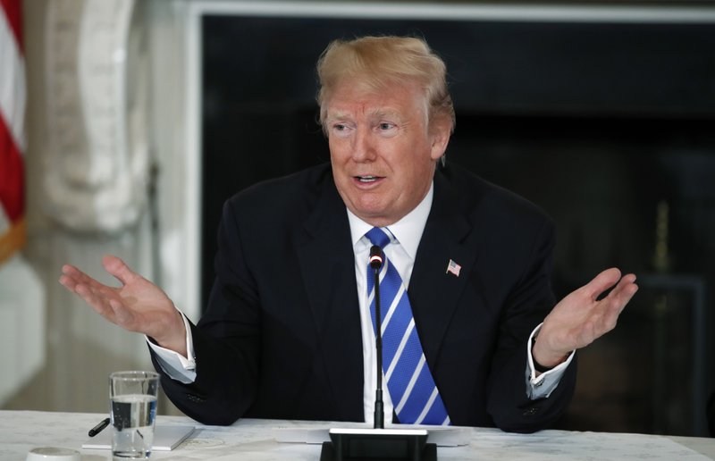 President Donald Trump speaks in the State Dining Room of the White House in Washington, Monday, Feb. 12, 2018, during a meeting with state and local officials about infrastructure. (AP Photo/Carolyn Kaster)