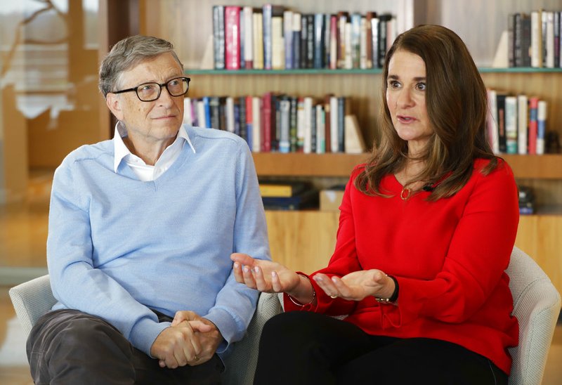 In this Feb. 1, 2018 photo, Microsoft co-founder Bill Gates and his wife Melinda take part in an interview with The Associated Press in Kirkland, Wash. The Gateses, as the world's top philanthropists, are rethinking their work in America as they confront what they consider their unsatisfactory track record on schools, the country's growing inequity and a president they disagree with more than any other.