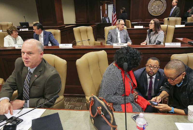 Sen. Jim Hendren (left) and fellow budget task force member Sen. Joyce Elliott (right) join Sen. Linda Chesterfield and Rep. Charles Blake at a Joint Budget Committee meeting Tuesday. 
