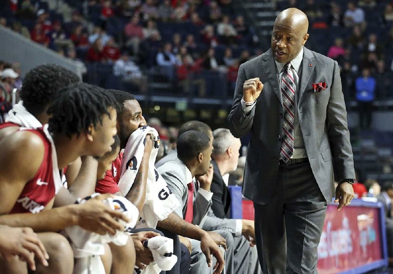 Arkansas forward Mike Anderson celebrates talks to players during the team's NCAA college basketball game against Mississippi in Oxford, Miss., Tuesday, Feb. 13, 2018. (Petre Thomas/The Oxford Eagle via AP)