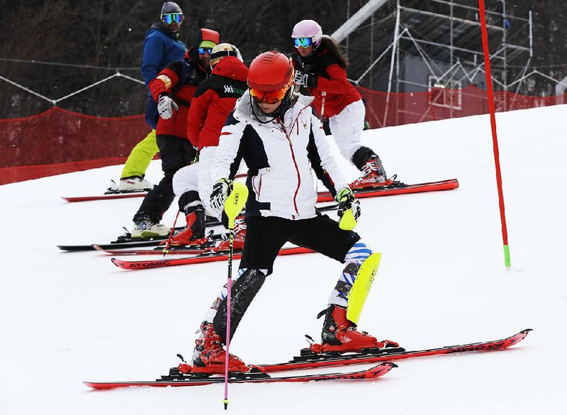 Mikaela Shiffrin (front) of the United States inspected the course at Yongpyong Alpine Center ahead of the women’s slalom, which was postponed from today to Friday because of strong winds. It’s the third time in four days an Alpine skiing race has been postponed because of unsafe winds.  