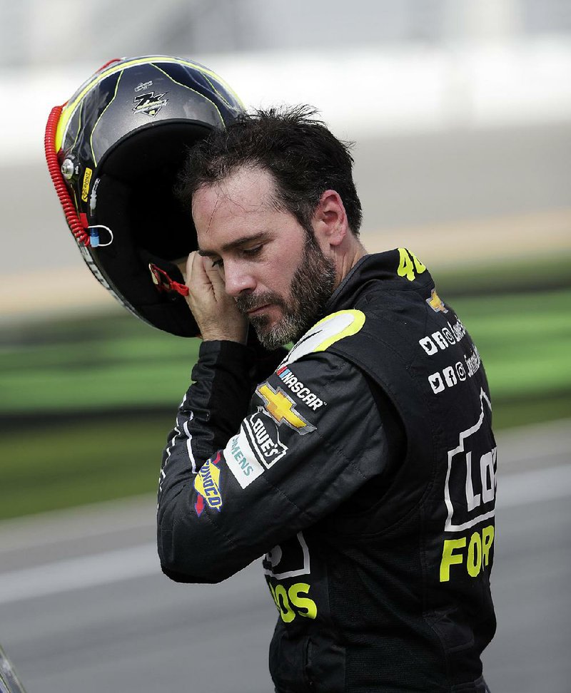 Jimmie Johnson removes his helmet after qualifying for the Daytona 500 on Sunday at Daytona International Speedway in Daytona Beach, Fla. Johnson, coming off the worst season of his career, is gearing up for a shot at his eighth NASCAR championship.