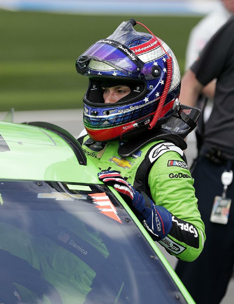 Danica Patrick climbs from her car Sunday after time trials for the Daytona 500. Sunday’s 500 will be Patrick’s final NASCAR start, leaving 44-year-old Jennifer Jo Cobb (Truck Series) as the only female driver in the NASCAR’s three top series. 