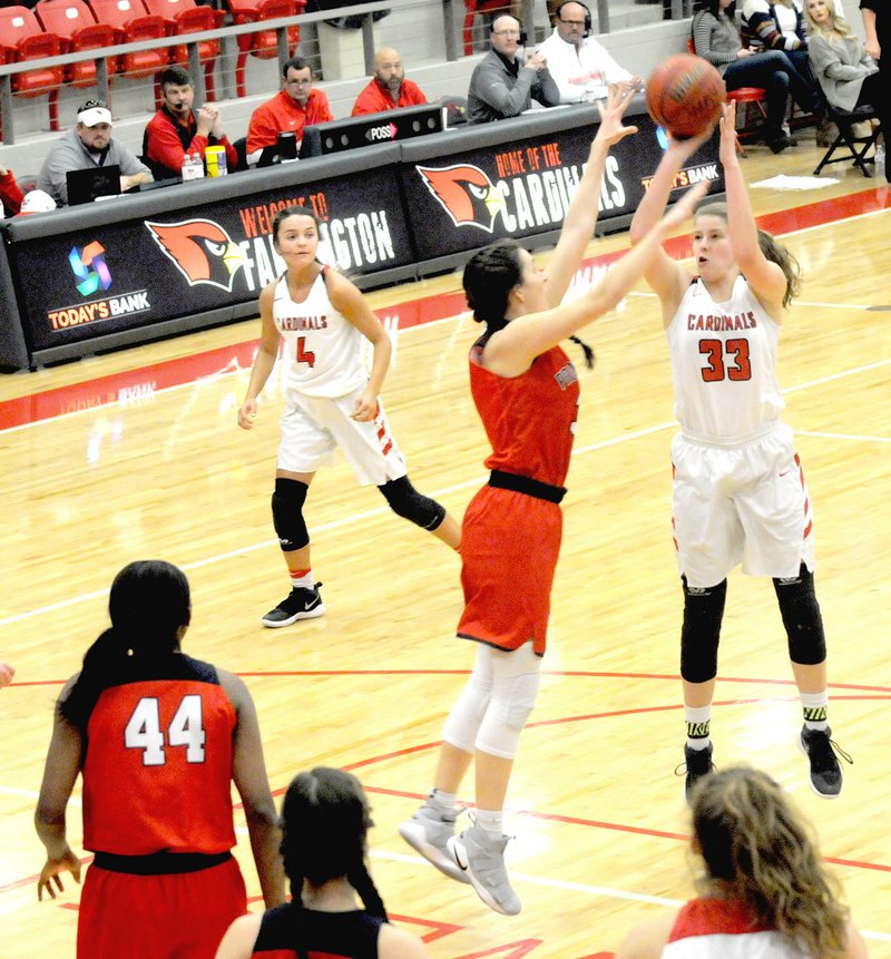 MARK HUMPHREY ENTERPRISE-LEADER Farmington sophomore Joelle Tidwell, shown scoring with a free-throw line jumper over Providence Academy's 6-0 senior Hayley Kate Webb, contributed 19 points to the Lady Cardinal victory over Clarksville, 60-46, on Feb. 7.