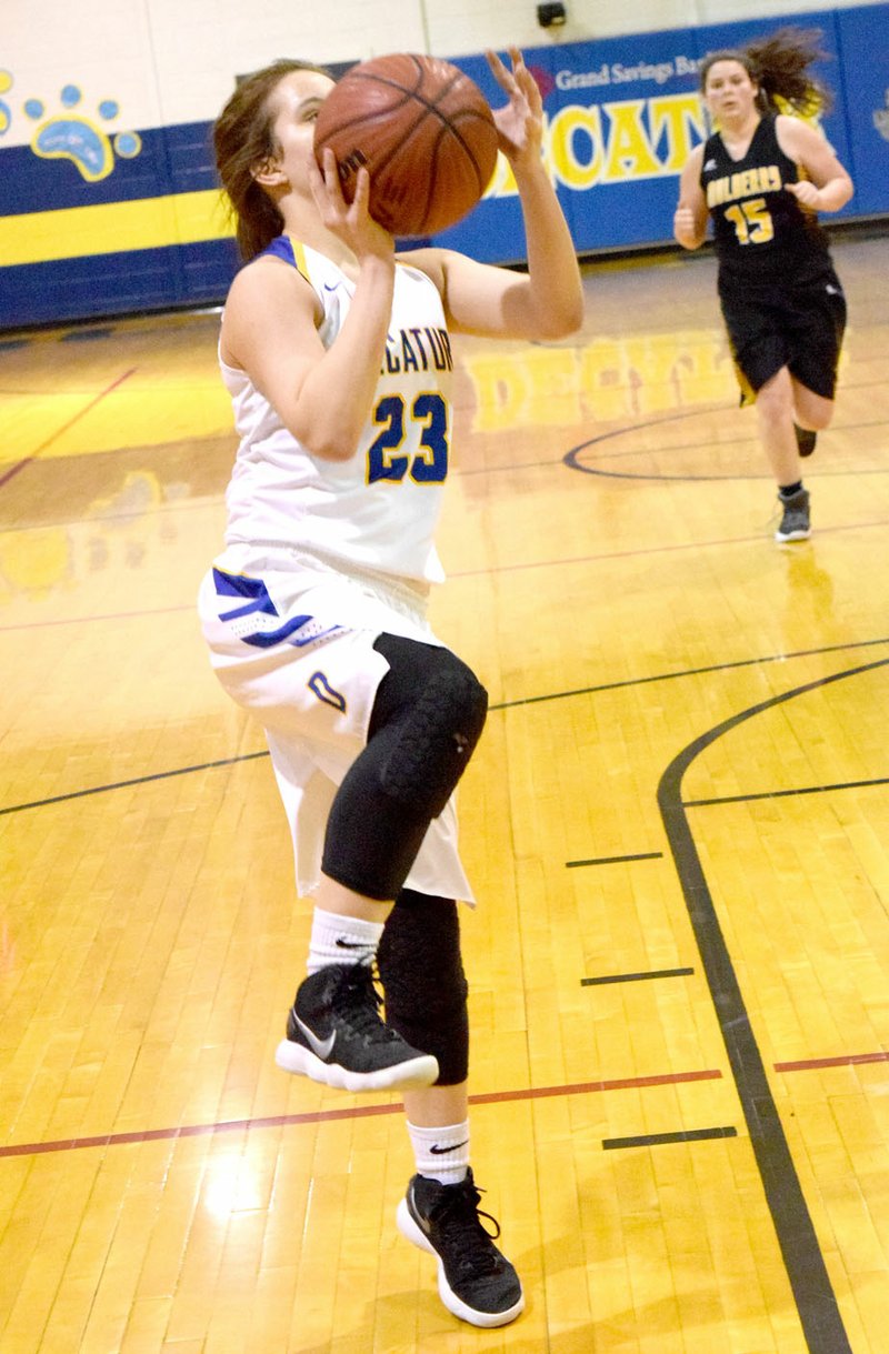 Westside Eagle Observer/MIKE ECKELS Decatur's Abby Tilley (23) goes for a jumper from outside the lane during the Decatur-Mulberry senior girls' basketball contest at Peterson Gym Feb 9. Tilley led the scoring for the Lady Bulldogs with 19 points including four three-point shots.