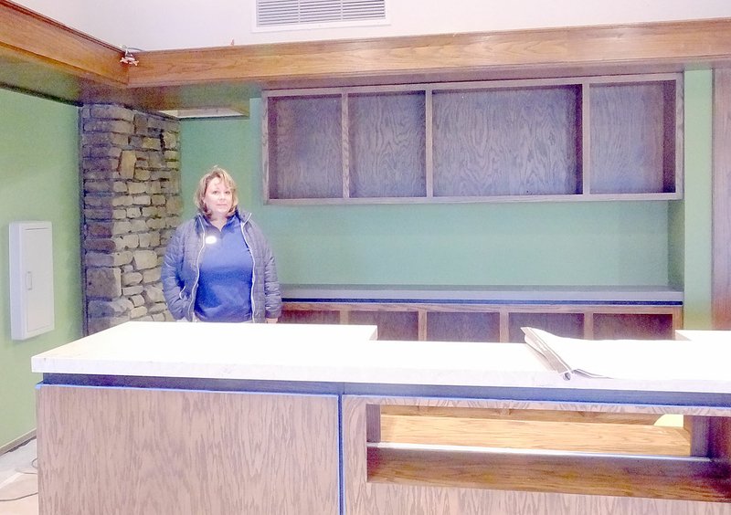 Lynn Atkins/The Weekly Vista Leslie Terry, the POA's merchandising and retail manager, stands behind the main counter of what will be the new pro shop inside the Country Club building.
