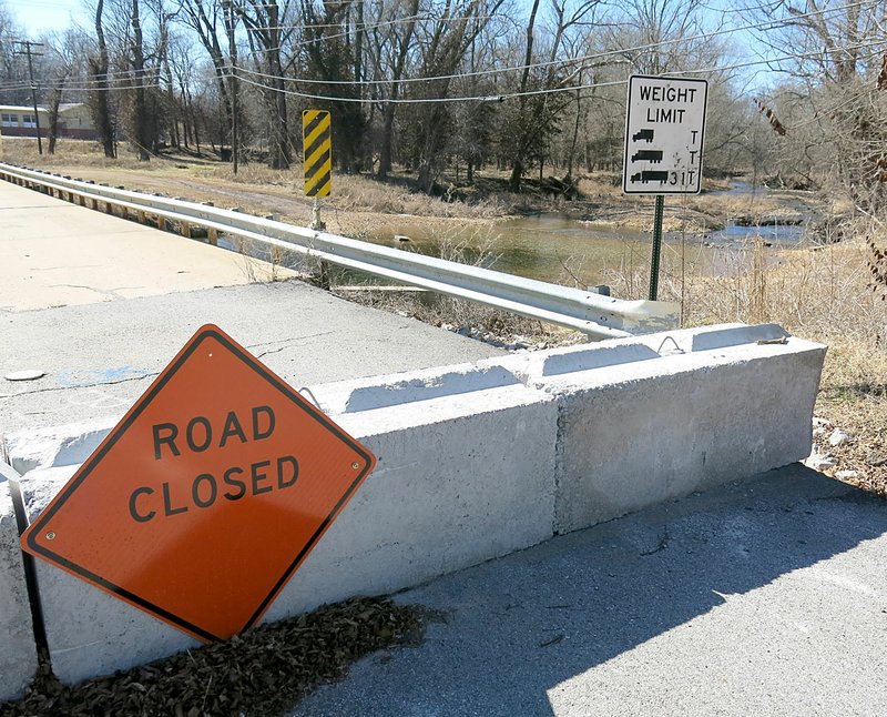 Westside Eagle Observer/RANDY MOLL With the bridge across Flint Creek closed and barricaded on Dawn Hill Road in Gentry due to April flooding, some have driven onto private property and through the creek rather than following the posted detours.