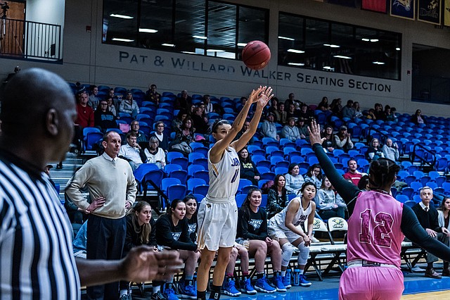 Photo courtesy of JBU Sports Information John Brown University's Kimmy Deines pulls up for a 3-point shot attempt during the Golden Eagles' 70-60 win against Science &amp; Arts (Okla.) inside Bill George Arena on Saturday.