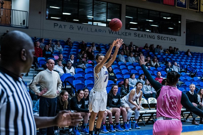 Photo courtesy of JBU Sports Information John Brown University's Kimmy Deines pulls up for a 3-point shot attempt during the Golden Eagles' 70-60 win against Science &amp; Arts (Okla.) inside Bill George Arena on Saturday.