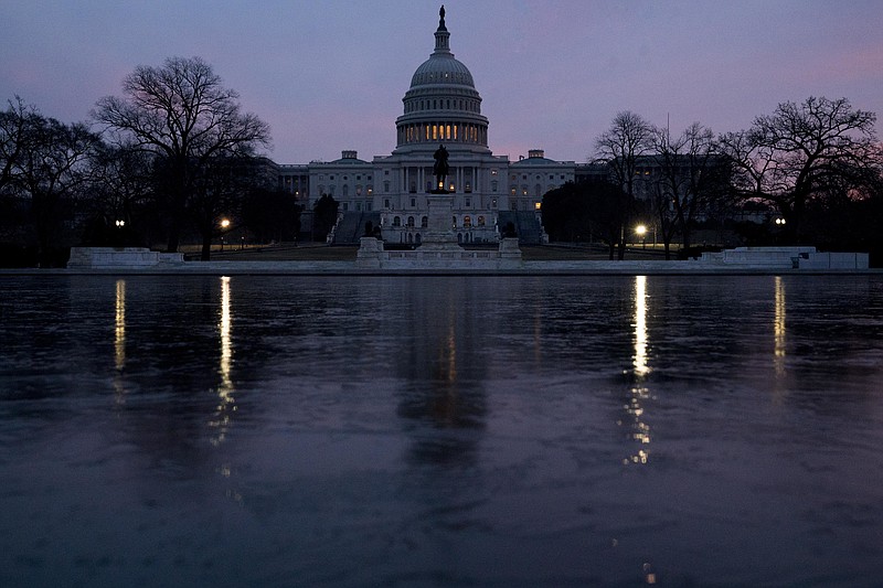 The Capitol Dome of the Capitol Building at sunrise, Friday, Feb. 9, 2018, in Washington. The Senate is ready for a showdown debate over immigration, including whether to protect young &quot;Dreamers&quot; from deportation, in an election-year battle that's sure to electrify both parties' most fervent voters and could well end in stalemate. (AP Photo/Andrew Harnik)