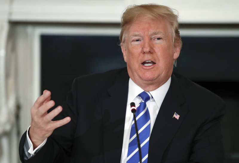 President Donald Trump speaks in the State Dining Room of the White House in Washington, Monday, Feb. 12, 2018, during a meeting with state and local officials about infrastructure. (AP Photo/Carolyn Kaster)