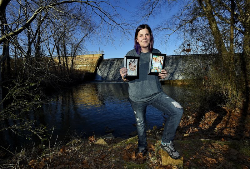 Sarah Sherbert poses for a photo in Anderson, S.C., on Monday, Feb. 5, 2018, holding photos of her children when they were infants. Sherbert, 31, said her drug use began eight years ago after she was prescribed opioid painkillers for injuries from a car accident. She was on methadone prescribed by her doctor when her daughter, now 3, was born. 
