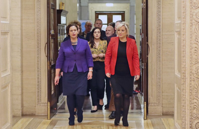 Sinn Fein's president Mary Lou McDonald, left, and Sinn Fein's vice president Michelle O'Neill, arrive to address the media at Stormont Parliament buildings in Belfast, Northern Ireland, Monday Feb. 12, 2018, as Britain's Prime Minister Theresa May and her Irish counterpart Leo Varadkar are holding crunch talks at Stormont House. Northern Ireland's Catholic-Protestant power-sharing government has been suspended since January 2017, but with renewed high level talks, both sides said Monday that progress has been made.