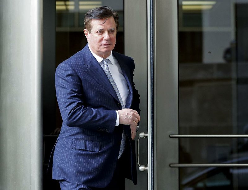 In this Feb. 14, 2018, file photo, Paul Manafort, President Donald Trump's former campaign chairman, leaves the federal courthouse in Washington.