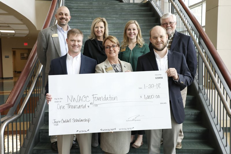 Courtesy photo Caddell Construction Co. presented a $1,000 check on Jan. 22 to Northwest Arkansas Community College for the Joyce Caddell Scholarship. The scholarship is given to a female student studying in the college's construction technology program. Shown are Ricky Byrd (front row, from left), vice president, Caddell Construction; Evelyn E. Jorgenson, president of NWACC; Zach Moore, senior project manager with Caddell Construction; (back row) Keith Peterson, dean of workforce development; Annetta Tirey, executive director of the NWACC Foundation; Karen O'Donohoe, annual giving officer, NWACC Foundation; and Bob Beeler, construction technology program coordinator, NWACC.