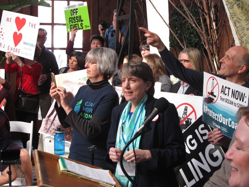 Cindy Zipf of the Clean Ocean Action environmental group, speaks against President Donald Trump's plan to allow offshore oil and gas drilling along most of the nation's coastline at a hearing Wednesday Feb. 14, 2018 in Hamilton, N.J. The hearing was one of many held by environmentalists and opponents of the drilling plan around the country before information sessions about the drilling plan held by the federal Bureau of Ocean Energy Management. (AP Photo/Wayne Parry)