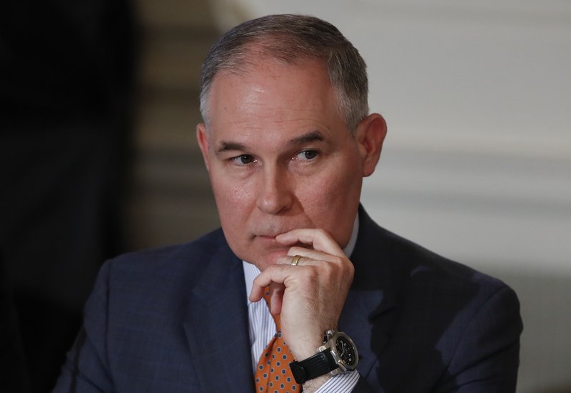 In this Feb. 12, 2018, photo, Environmental Protection Agency Administrator Scott Pruitt attends a meeting with state and local officials and President Donald Trump about infrastructure in the State Dining Room of the White House in Washington. Pruitt has broken months of silence about his frequent use of premium-class airfare at taxpayer expense, saying he needs to fly first class because of unpleasant interactions with other travelers. (AP Photo/Carolyn Kaster)