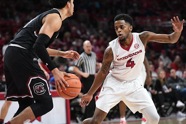Arkansas guard Daryl Macon defends a South Carolina dribbler during a game Tuesday, Feb. 6, 2018, in Fayetteville. 