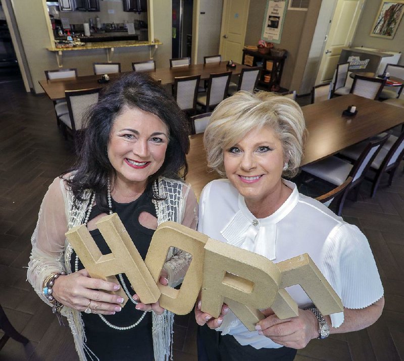 The Hope Lodge’s dining room is where most of the sharing and caring happen for area cancer patients. 20th Century Club members like Martha Ellen Talbot (left) and Lisa Wright, co-chairmen for this year’s Hope Ball fundraiser, work hard to help the residents feel at home. Talbot says, “It’s just a beautiful mix of women.” 