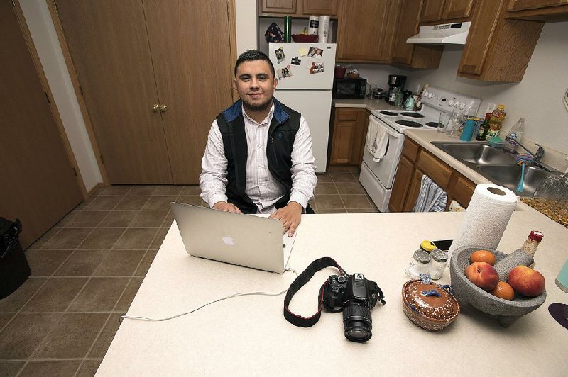 Irvin Camacho in his Springdale apartment Sunday Feb. 4, 2018 at the counter where he makes all of his videos for the public.