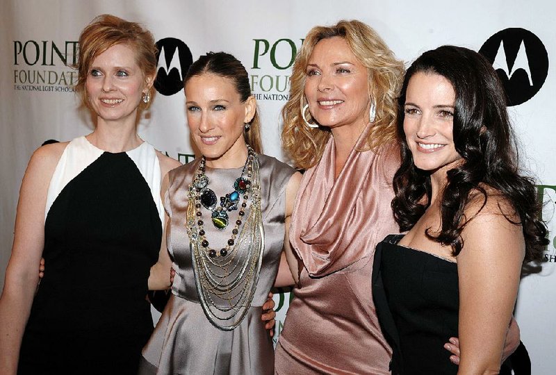Cat(trall) fight! Kim Cattrall (third from left) has called out her Sex and the City co-star Sarah Jessica Parker (second from left).