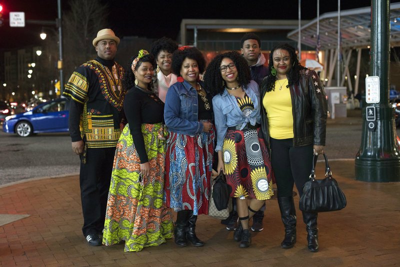 The Lawton family poses for a portrait before seeing Black Panther in Silver Spring, Md., Thursday, Feb. 15, 2018. 