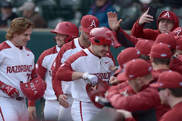 Arkansas second baseman Carson Shaddy wears a hog hat after hitting a home run during a game against Bucknell on Friday, Feb. 16, 2018, in Fayetteville. 