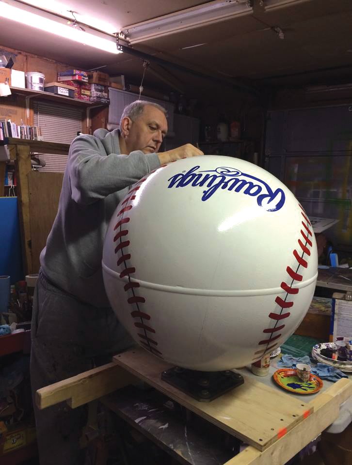 Donald Smith Jr. of Newport has been making art since he was a young boy. Now the owner of Signs by Don Smith in Newport, the artist was asked several years ago by a man in Batesville to take a round piece of metal he had found in a junkyard and create a baseball from it. He is shown here completing the piece of art, which, he said, spins on a base.