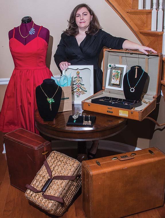 Amy Bonds Green of Maumelle will take a variety of her artwork to the 10th annual Delta Visual Arts Show in Newport. She repurposes vintage jewelry, seen displayed here in various ways. She also takes vintage greeting cards, as seen in the left-hand corner of the open suitcase, and puts them in double-paned frames so the viewer can see the front of the card, as well as the greeting, often handwritten, on the inside.