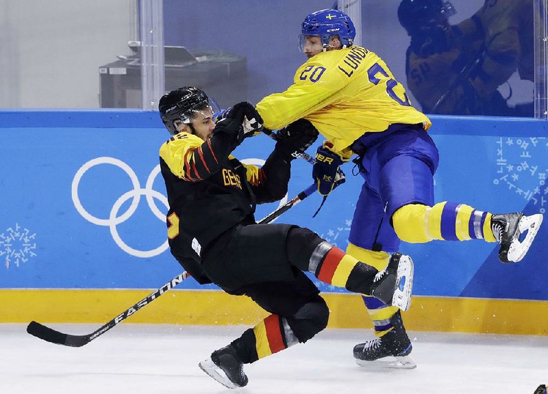 Pyeongchang Olympics Joel Lundqvist (20) of Sweden collides with Germany’s Yasin Ehliz during the third period of Sweden’s 1-0 victory in men’s hockey Friday in Group C preliminary round action at Gangneung, South Korea. Sweden joined Finland with a 2-0 record atop the group standings. 