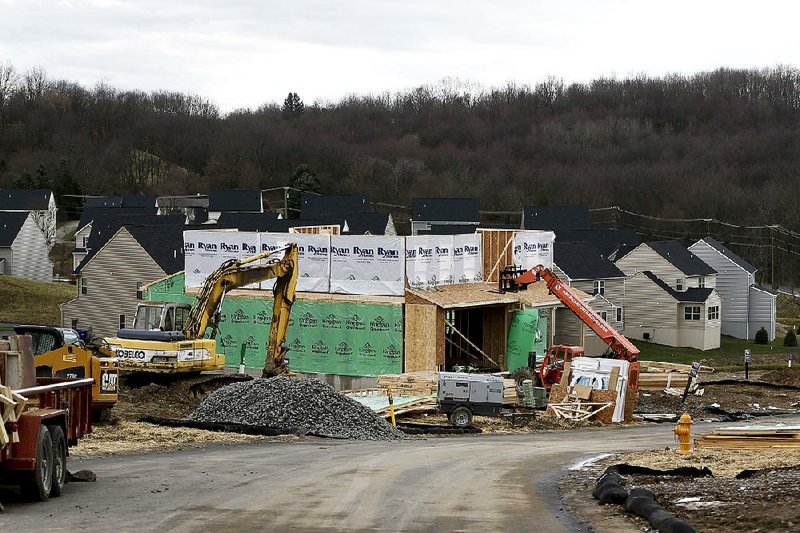 Work continues at a housing development in Zelienople, Pa. Despite January’s jump in home construction, builders haven’t been moving fast enough to meet demand.