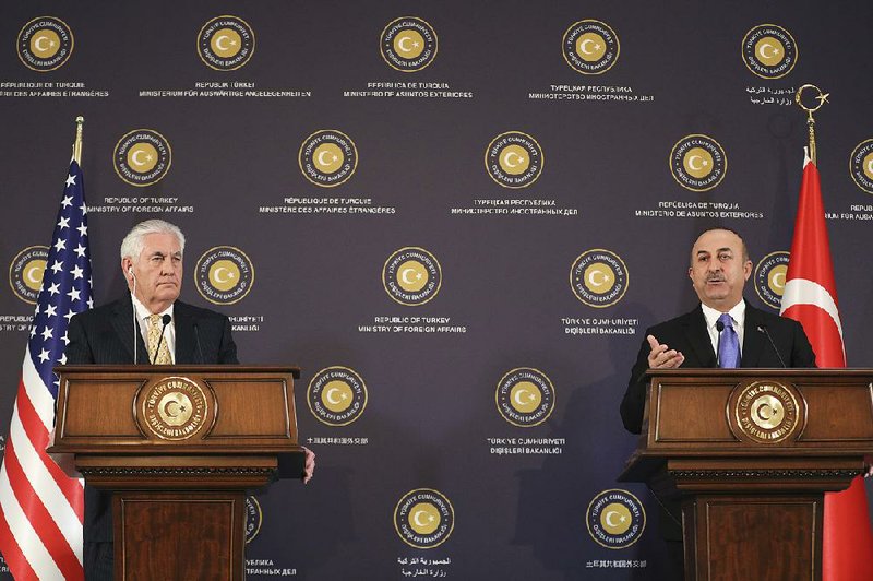 Turkish Foreign Minister Mevlut Cavusoglu (right) and U.S. Secretary of State Rex Tillerson hold a news conference Friday in Ankara, where both men said a “crisis” had been turned aside. 