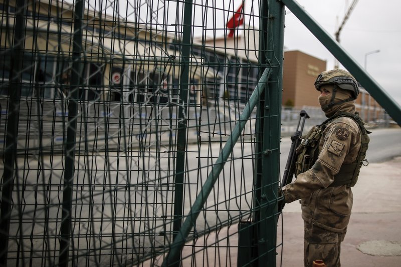 A Turkish soldier stands outside the prison complex where Deniz Yucel, a Turkish-German journalist working for German newspaper Die Welt who was detained in Turkey for more than a year, has been released from jail, in Silivri, Turkey Friday, Feb. 16, 2018, German officials and his employer said. A spokesman for Germany's foreign ministry confirmed a report by daily Die Welt that Yucel had been freed.(AP Photo/Emrah Gurel)