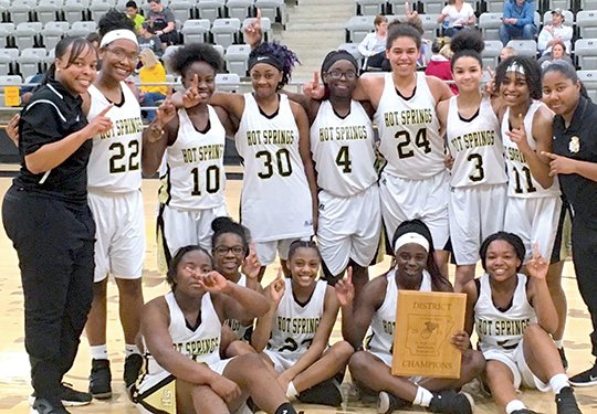 Subitted photo DISTRICT CHAMPS: The Hot Springs junior Lady Trojans defeated Lakeside 31-16 in the championship game of the 5A-South junior high girls' district tournament Thursday in De Queen. Team members, from left, in front are India Hudson, Ivy Scott, Tamia Dolls, Jaylia Reed, and Nadiya Valrie, and back, from left, head coach Keysha Hill, Alix Frazier, Tylecia Easter, Jaeonna West, Ashanti Brown, Jurnee Hicks, Amiya Campbell, Darnesa Hudson and assistant coach Nicole Lowe.