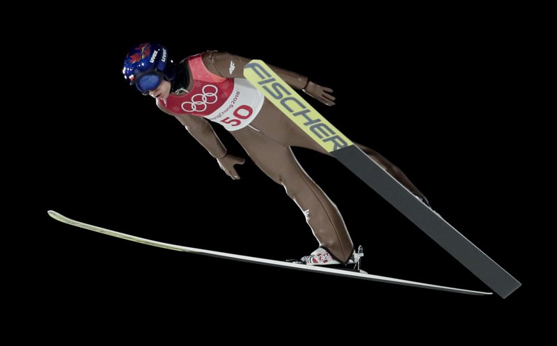 Kamil Stoch, of Poland, soars through the air during men's large hill Individual ski jumping competition at the 2018 Winter Olympics in Pyeongchang, South Korea, Saturday, Feb. 17, 2018. 