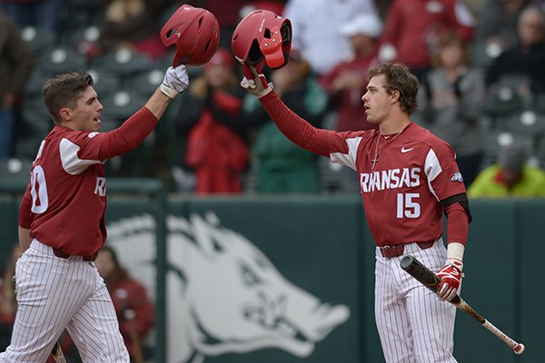 Arkansas second baseman Carson Shaddy (left) celebrates with third baseman Casey Martin after hitting a home run against Bucknell Saturday, Feb. 17, 2018, during the second inning at Baum Stadium in Fayetteville. 