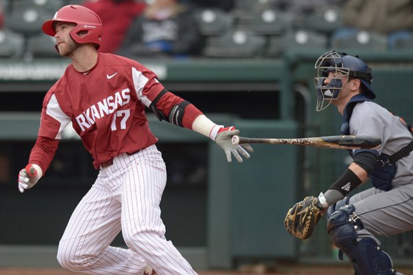 Arkansas outfielder Luke Bonfield hits a home run during the first inning of a game against Bucknell on Saturday, Feb. 17, 2018, in Fayetteville.