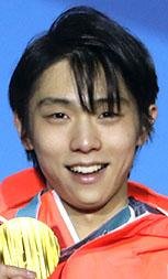 Gold medalist in men's free figure skating Yuzuru Hanyu, of Japan, smiles during the medals ceremony at the 2018 Winter Olympics in Pyeongchang, South Korea, Saturday, Feb. 17, 2018. 