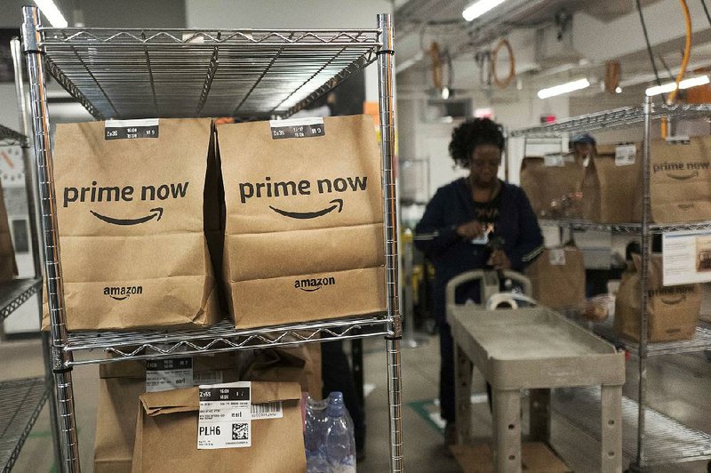 An Amazon worker sorts Prime Now customer orders in a warehouse in New York in this 2017 file photo. 