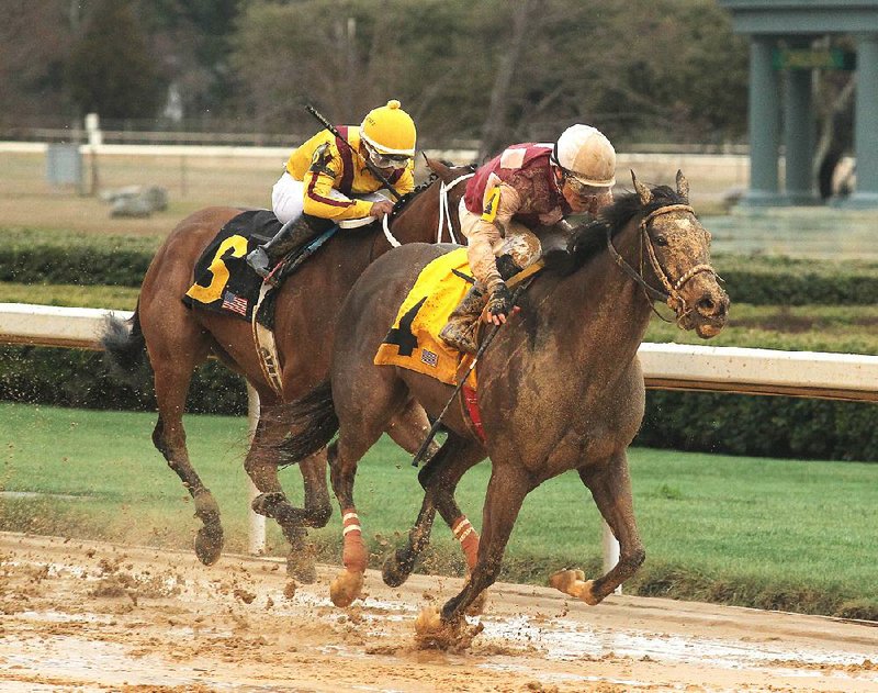 Gary Stevens crosses the wire on Streamline (4) to win the $150,000 Bayakoa Stakes at Oaklawn Park in Hot Springs ahead of Terra Promessa (6) with jockey Ricardo Santana. Streamline’s winning time was 1:47.22 and paid $8.40.  